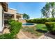 Lush backyard showcasing a charming pool, surrounded by greenery and mature landscaping at 3387 E Bluejay Dr, Chandler, AZ 85286