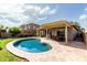 Backyard features a covered patio with a beautiful pool at 3387 E Bluejay Dr, Chandler, AZ 85286
