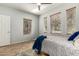 Bright bedroom with three windows, neutral paint and tiled floors at 3387 E Bluejay Dr, Chandler, AZ 85286
