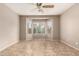 Sunlit bedroom with a ceiling fan and a large bay window for natural light and outdoor views at 3387 E Bluejay Dr, Chandler, AZ 85286