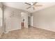 Bright bedroom featuring a ceiling fan, neutral walls, and a view leading into an ensuite bathroom at 3387 E Bluejay Dr, Chandler, AZ 85286