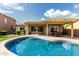 Inviting backyard pool with a covered patio, perfect for outdoor entertaining and relaxation at 3387 E Bluejay Dr, Chandler, AZ 85286