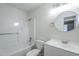 Modern bathroom with white fixtures and a shower-tub combo at 340 W Riviera Dr, Tempe, AZ 85282
