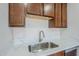 A bright kitchen with stainless steel sink and new light countertops at 340 W Riviera Dr, Tempe, AZ 85282