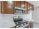 Kitchen featuring new stainless steel appliances and light countertops at 340 W Riviera Dr, Tempe, AZ 85282