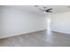 Bright living room features light wood floors and a modern ceiling fan at 340 W Riviera Dr, Tempe, AZ 85282