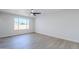 Open living room featuring modern light fixture and a bright window at 340 W Riviera Dr, Tempe, AZ 85282