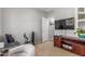 Well-lit bedroom with a comfortable sitting area and modern entertainment setup at 36197 W Cartegna Ln, Maricopa, AZ 85138