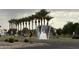 Community entrance with water feature surrounded by palm trees and signage, creating a welcoming first impression at 36197 W Cartegna Ln, Maricopa, AZ 85138