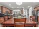 Beautiful dining area connects kitchen, stainless steel appliances and breakfast bar, with seamless access to living areas at 36197 W Cartegna Ln, Maricopa, AZ 85138