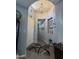 Welcoming entryway features a decorative rug, arched ceiling, and stylish lighting, leading into the home's interior at 36197 W Cartegna Ln, Maricopa, AZ 85138