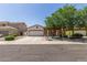 Charming single-story home with stucco and stone accents, tile roof, and a well-manicured front yard at 36197 W Cartegna Ln, Maricopa, AZ 85138