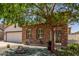 Charming single-story home with stucco and stone accents, tile roof, and a well-manicured front yard at 36197 W Cartegna Ln, Maricopa, AZ 85138