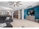 Bright, open-concept living space with modern furnishings flows seamlessly into the kitchen and dining area, perfect for gatherings at 36197 W Cartegna Ln, Maricopa, AZ 85138