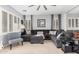 Cozy living room boasts comfortable seating, natural light, and stylish décor, ideal for relaxation and entertainment at 36197 W Cartegna Ln, Maricopa, AZ 85138