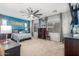 Another view of the main bedroom showcasing plenty of windows, natural light, and a neutral color scheme at 36197 W Cartegna Ln, Maricopa, AZ 85138
