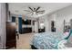 Another view of the main bedroom showing a large bed, a closet, and a door leading to the bathroom at 36197 W Cartegna Ln, Maricopa, AZ 85138