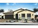 Inviting single-story home featuring a desert landscape, a two car garage, and a tile roof at 3718 E Gold Mountain Ave, San Tan Valley, AZ 85143