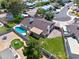 Backyard featuring lush lawn area, pool, patio with shade cover, and play area at 4115 W Danbury Dr, Glendale, AZ 85308