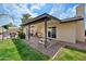 Inviting covered patio with seating, overlooking a lush backyard with a pool, perfect for outdoor living at 4115 W Danbury Dr, Glendale, AZ 85308