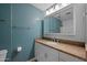 Bathroom featuring granite counters, vanity with plenty of storage, and stylish lighting at 4115 W Danbury Dr, Glendale, AZ 85308