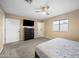 Bedroom with carpeted floors, ceiling fan, dresser, and a window, offering comfort and functionality at 4115 W Danbury Dr, Glendale, AZ 85308