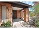 The brick home with a well-kept yard, featuring a covered front entry with brick columns at 4115 W Danbury Dr, Glendale, AZ 85308