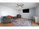 Relaxing living room with tile flooring, ceiling fan and comfortable seating at 4115 W Danbury Dr, Glendale, AZ 85308