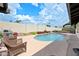 Inviting backyard pool with landscaped border and lounge chairs for relaxing on sunny days at 4115 W Danbury Dr, Glendale, AZ 85308