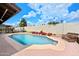 A serene backyard pool area with an inviting pool and surrounding landscape perfect for outdoor enjoyment at 4115 W Danbury Dr, Glendale, AZ 85308