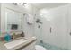 Modern bathroom featuring a glass enclosed shower with white subway tile and decorative mosaic flooring at 5047 N 83Rd St, Scottsdale, AZ 85250