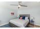 Cozy bedroom with a wooden bed frame, blue accents, and soft lighting at 5047 N 83Rd St, Scottsdale, AZ 85250
