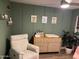 Serene Bedroom with calming green walls, cute animal art, and a comfortable chair at 5047 N 83Rd St, Scottsdale, AZ 85250