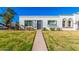 Charming single-story home with well-maintained lawn and walkway at 5047 N 83Rd St, Scottsdale, AZ 85250
