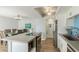 Contemporary kitchen with stainless appliances, a kitchen island, and adjacent dining area with seating for six at 5047 N 83Rd St, Scottsdale, AZ 85250