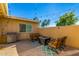 Cozy outdoor patio with a fire pit, comfortable seating, and decorative string lights at 5047 N 83Rd St, Scottsdale, AZ 85250