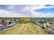 Panoramic aerial view of a tranquil neighborhood with mature trees, well-maintained streets, and manicured lawns at 5052 W Boston S Way, Chandler, AZ 85226