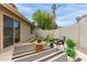 Relaxing outdoor space with a covered patio, artificial turf, and stylish seating area at 5052 W Boston S Way, Chandler, AZ 85226
