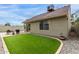Inviting backyard featuring a manicured lawn and patio, perfect for outdoor gatherings and relaxation at 5052 W Boston S Way, Chandler, AZ 85226