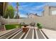 Cozy backyard featuring a striped rug, outdoor seating, potted plants, and a well-manicured artificial grass patch at 5052 W Boston S Way, Chandler, AZ 85226