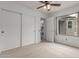 Bedroom featuring a ceiling fan and closet at 5052 W Boston S Way, Chandler, AZ 85226