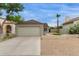 Charming home exterior with a two-car garage, neat landscaping, and a welcoming curb appeal at 5052 W Boston S Way, Chandler, AZ 85226