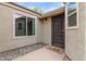 Charming front entrance with a decorative door, stylish lighting, and well-maintained landscaping at 5052 W Boston S Way, Chandler, AZ 85226