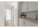 Hallway with tile flooring and built in cabinets at 5052 W Boston S Way, Chandler, AZ 85226