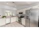 Well-lit kitchen with stainless steel appliances, and a pass-through window at 5052 W Boston S Way, Chandler, AZ 85226