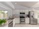 Bright kitchen featuring white cabinets and stainless steel appliances at 5052 W Boston S Way, Chandler, AZ 85226