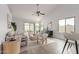 Open concept living room with lots of seating, bright colors and sliding glass doors at 5052 W Boston S Way, Chandler, AZ 85226