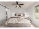 Bedroom with a ceiling fan and sliding barn door at 5052 W Boston S Way, Chandler, AZ 85226