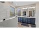 Bright bathroom with double sinks, modern fixtures, and a walk-in shower at 517 S 165Th Dr, Goodyear, AZ 85338