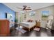 Tranquil bedroom with a cozy bed, ample natural light, and a stylish accent wall at 517 S 165Th Dr, Goodyear, AZ 85338